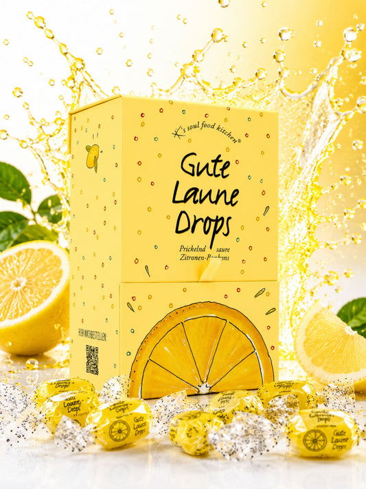 Gute Laune Drops Dispenser 1kg von K's Soul Food Kitchen vor buntem Hintergrund mit Zitronen