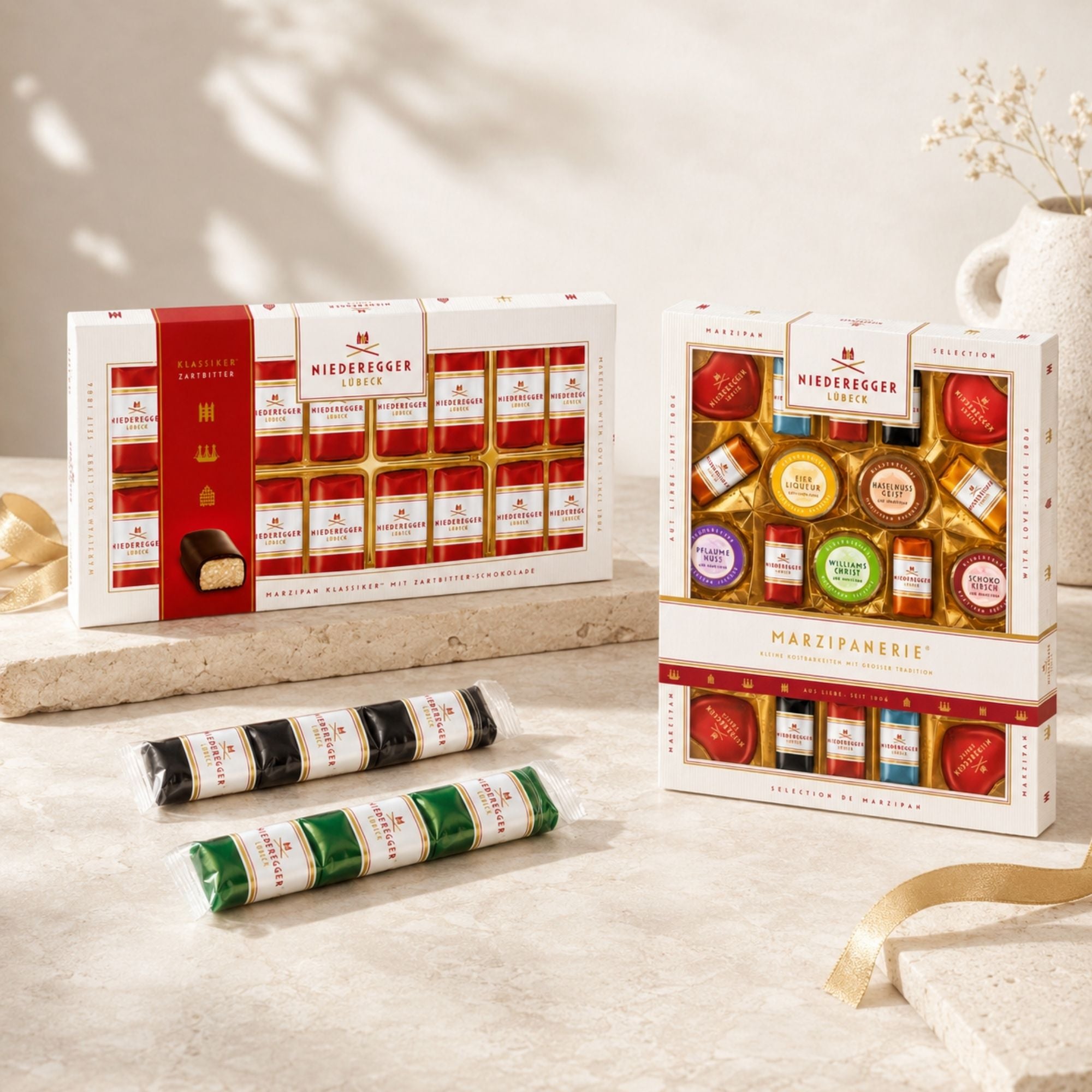 Niederegger Klassiker-Pralinen und Marzipanerie Geschenkbox auf Premium-Untergrund